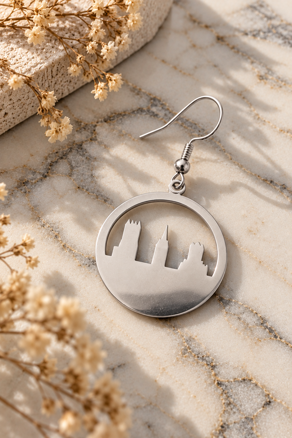 Circle Skyline Earrings Silver on light marble with dried flowers