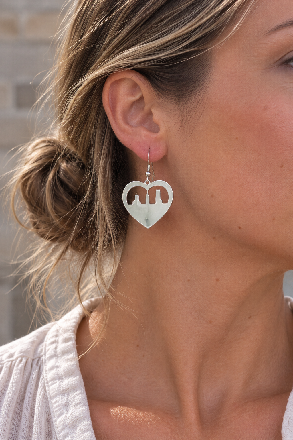 Model wearing Heart Skyline Earrings Silver by Van Gent Studio